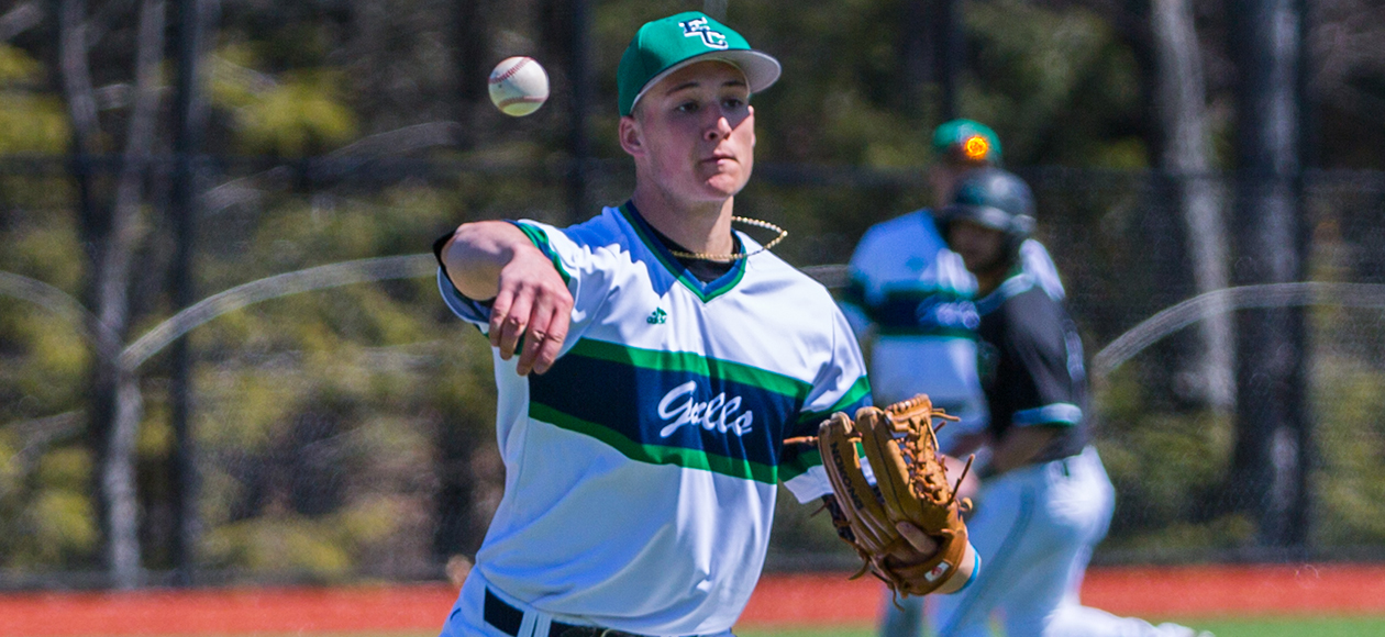 Alexander Mandrus throws a baseball towards first base